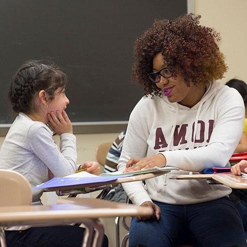 Teacher sharing moment with adolescent student